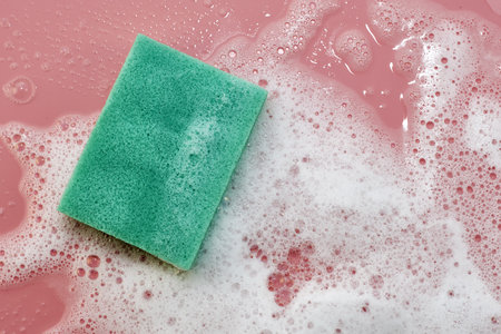 soap foam and sponge on a pink background. high quality photoの写真素材