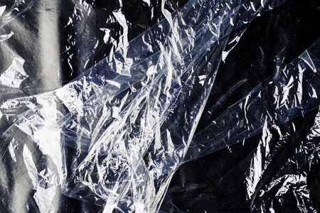 black cellophane bag close-up background texture of plastic. high quality photoの写真素材
