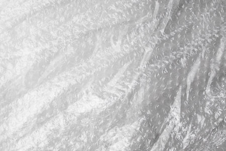 transparent cellophane bag close-up background texture of plasticの写真素材