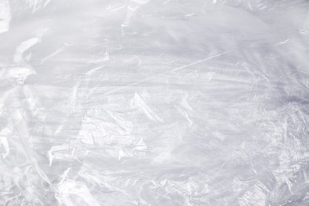transparent cellophane bag close-up background texture of plasticの写真素材