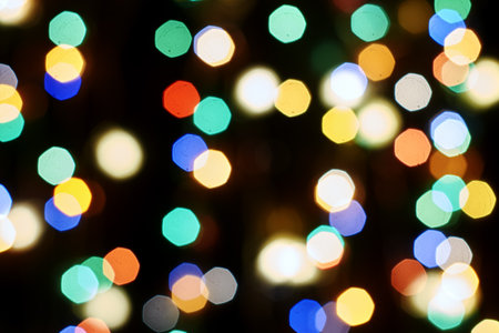 multicolored festive lights on a black background screensaver backdropの写真素材