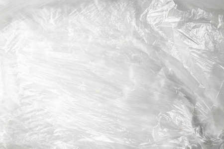 transparent cellophane bag close-up background texture of plasticの写真素材