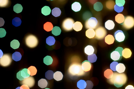 multicolored festive lights on a black background screensaver backdropの写真素材