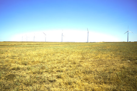 wind farm in the steppe against the blue sky. high quality photoの写真素材