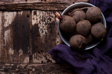beet on a wooden background with sunlightの写真素材