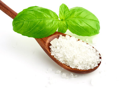 coarse sea salt on white backgroundの写真素材