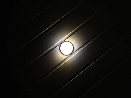 Night light on the ceiling minimalism abstract lamp black whiteの写真素材