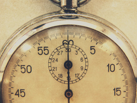 stopwatch retro vintage antiques macro closeup wallpaper background value measure time old clock arrow minute second accuracy timer recordの写真素材