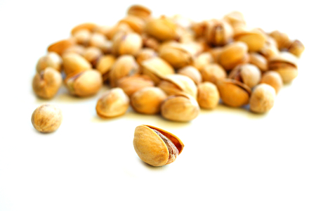 Fried salted pistachios nut food taste delicious beneficial features harvest appetite isolateの写真素材