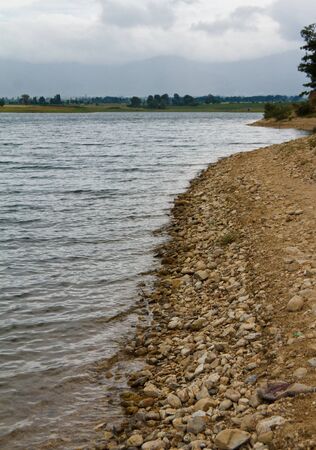 Lake shore with rocksの写真素材