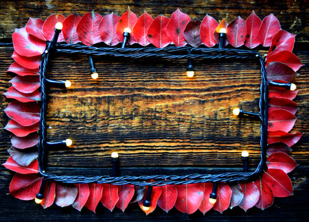 frame of pear red leaves and garland, autumn time