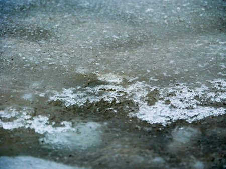 Evening on an frozen lake ice waterの写真素材