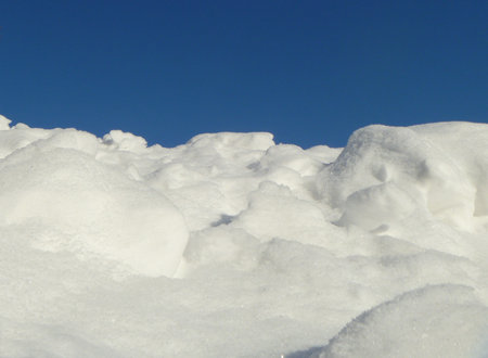White snowdrift on background blue sky