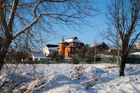 Winter landscape in rural terrain on background blue skyの写真素材