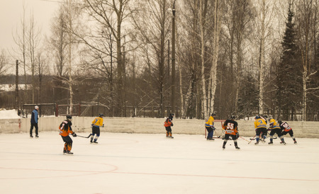 Mstera,Russia-January 14,2017: Game of hockey on icy platform between command in January 14,2017 in city Mstera,Russiaのeditorial素材