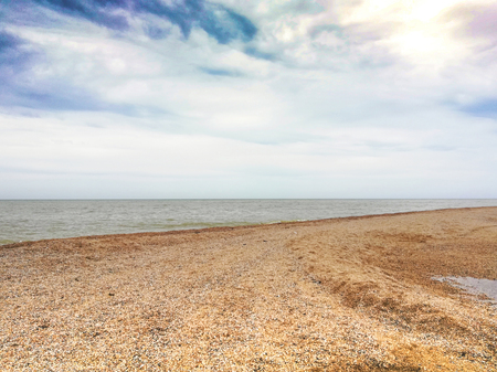 Beautiful seascape at solar day on background blue sky with white cloudの写真素材
