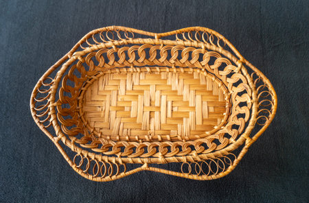 The Braided basket from twig of the osier for fruit. The Beautiful decorative kitchen utensil on...