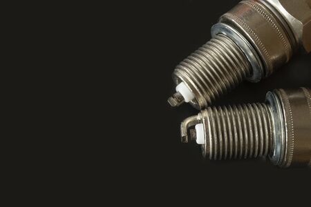 The Car spark plug on dark background. Electric device for car,Space for designの写真素材