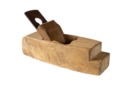 Wooden plane for wood processing by a joiner. Old carpenter's tool isolated on white background