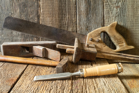 A set of tools on a wooden board. Industrial objects on a gray backgroundの写真素材