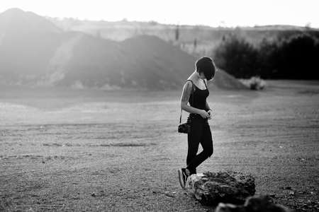 professional photographer*, taking pictures of a beautiful nature surrounding her*, warm sunny day*, Young woman*の写真素材