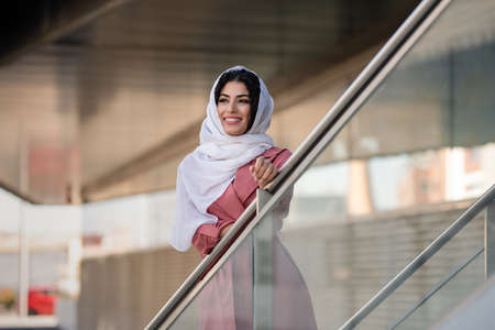 Mixed race young woman wearing hijab on the streetの写真素材