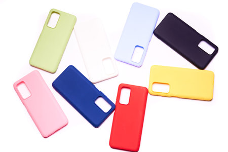 Colorful plastic back covers for mobile phones on white background. mobile phone protection. copy...