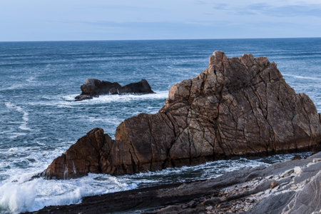 Steep crags at the Atlantic Ocean in a peaceful afternoon.