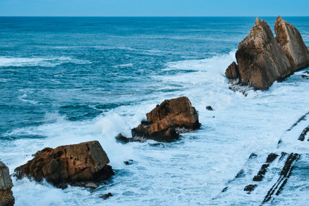 Furious waves breaking with fierce against the coast in northern Spain.