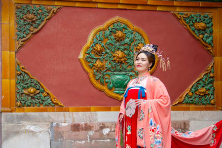 Beijing, China - November 21 2019: A young Chinese model poses inside the Forbidden City in Beijing, November 21 2019, Beijing Chinaのeditorial素材