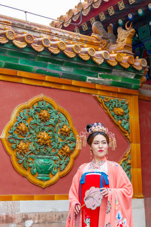 Beijing, China - November 21 2019: A young Chinese model poses inside the Forbidden City in Beijing, November 21 2019, Beijing Chinaのeditorial素材