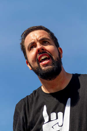 Manises, Valencia, SPAIN - "RubÃ©n", entertainer of the rock group of music in Valencian for children Ramonets, during a concert during the COVID 19 pandemic. October 18, 2020 Manises, Valenciaのeditorial素材