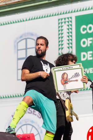 Manises, Valencia, SPAIN - "RubÃ©n", entertainer of the rock group of music in Valencian for children Ramonets, during a concert during the COVID 19 pandemic. October 18, 2020 Manises, Valenciaのeditorial素材