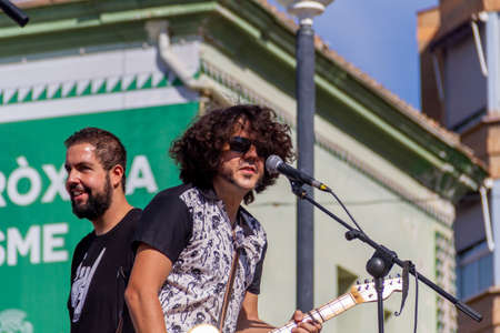 Manises, Valencia, SPAIN - "RubÃ©n" and "Robert", of the rock group of music in Valencian for children Ramonets, during a concert during the COVID 19 pandemic. October 18, 2020 Manises, Valencia SPAINのeditorial素材