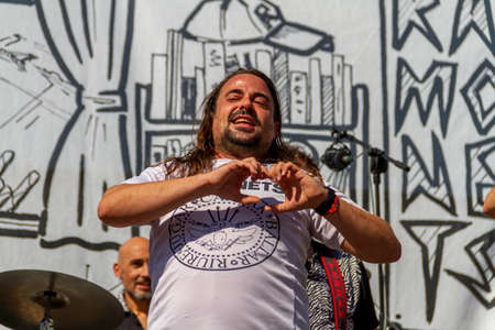 Manises, Valencia, SPAIN - "Urbano", entertainer of the rock group of music in Valencian for children Ramonets, during a concert during the COVID 19 pandemic. October 18, 2020 Manises, Valencia SPAINのeditorial素材