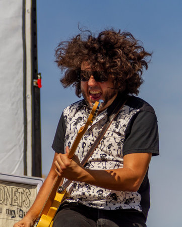 Manises, Valencia, SPAIN - Robert, lead guitarist of the music rock band in Valencian for children...