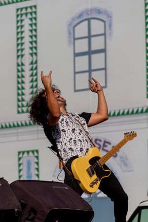 Manises, Valencia, SPAIN - "Robert", lead guitarist of the music rock band in Valencian for children Ramonets, during a concert during the COVID 19 pandemic. October 18, 2020 Manises, Valencia SPAINのeditorial素材