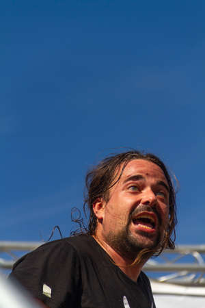 Manises, Valencia, SPAIN - "Urbano", entertainer of the rock group of music in Valencian for children Ramonets, during a concert during the COVID 19 pandemic. October 18, 2020 Manises, Valencia SPAINのeditorial素材