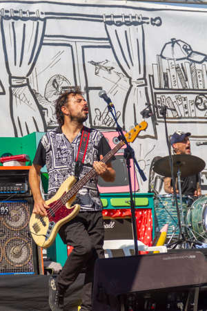 Manises, Valencia, SPAIN - "Tol", bass player of the rock group of music in Valencian for children Ramonets, during a concert during the COVID 19 pandemic. October 18, 2020 Manises, Valencia SPAINのeditorial素材