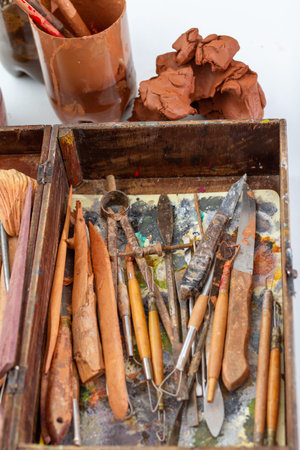 Art concept. Instruments used to model sculpture. Box with various tools and objects that are used...