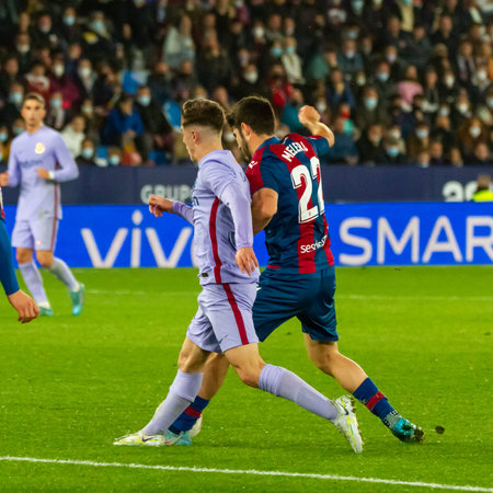 Valencia, (SPAIN) - April 10, 2022 - The FC Barcelona player Gavi disputes a ball with the Levante...