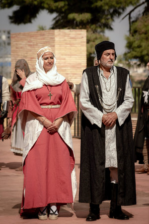 Valencia, Spain - October 9, 2022: Representation of the Middle Ages, married couple dressed in rich...