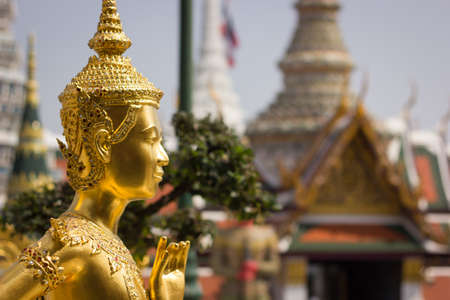 Golden statue of a Kinnara in the Buddhist Temple of Wat Phra Kaewの写真素材