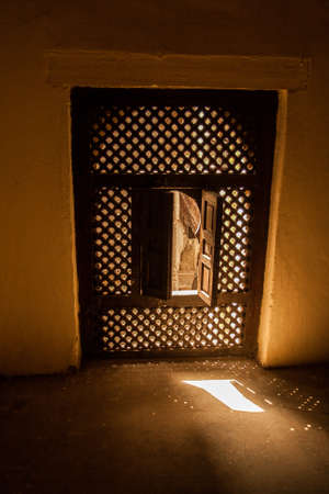 Window in backlight inside moroccan kasbahのeditorial素材