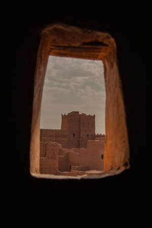 Moroccan tipical kasbah beyond windowの写真素材