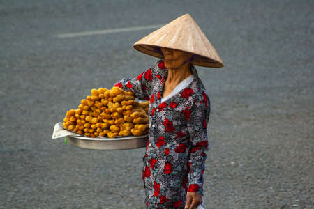 Unidentified woman seller in the old quarter of Saigon, Vietnamのeditorial素材