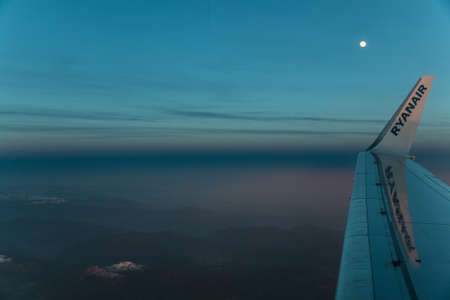 The Boeing 737-800 of the company Ryanair flying between italian Alpesのeditorial素材