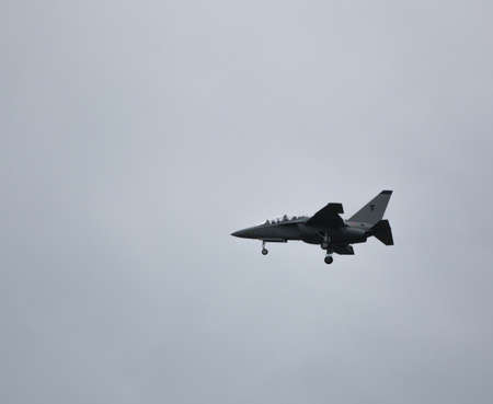 Airplane Aermacchi M346 before landing at airportの写真素材