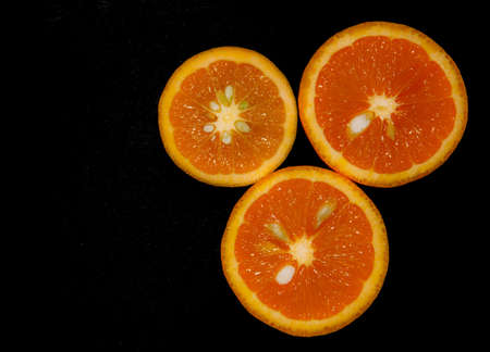 Oranges isolated on black backgroundの写真素材