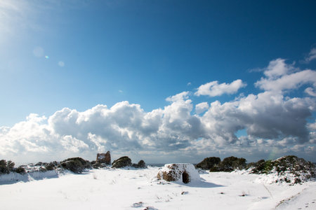 Uluzzo tower after a exceptional snowfall. Jan 2017, Salento, Italy.